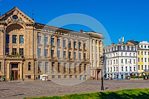 People are walking in front of the Latvijas Radio - Latvia's rad photo