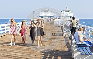 People walking on the Malibu Pier.