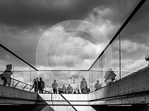 People walking on the Millennium Bridge London