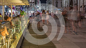 People walking in the Old city center of Vienna in Stephansplatz night timelapse photo