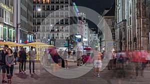 People walking in the Old city center of Vienna in Stephansplatz night timelapse photo