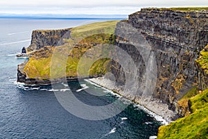 People walking over Cliffs of Moher