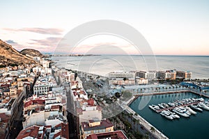 People walking on the Paseo Maritimo in the touristic city of Alicante in Spain in 2022