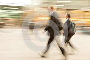 People walking past a office building