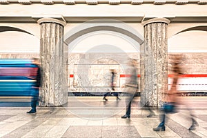 People walking on platform of underground subway metro station