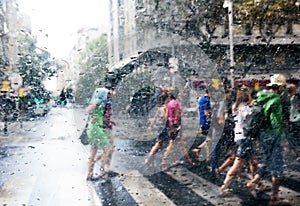 People walking in the rain in the city
