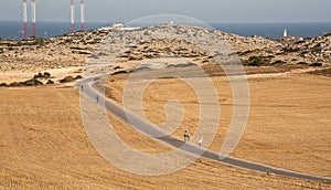 People walking on a road at Cape Greko peninsula in Cyprus