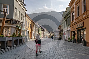 People walking through Strada Michael Weiss, Brasov city