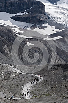 People walking towards Athabasca Glacier in Jasper National Park, Alberta