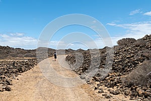 People walking the trails on the uninhabited and exotic island of Lobos, very close to Fuerteventura