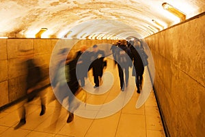 People walking in an underpass