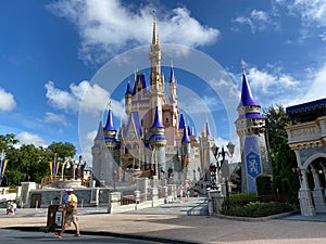 People walking up to Cinderella`s Castle in the Magic Kingdom at  Walt Disney World Resorts in Orlando, FL