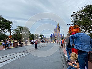 People walking up to Cinderella`s Castle in the Magic Kingdom at  Walt Disney World Resorts in Orlando, FL