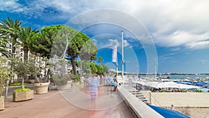 People walking at waterfront near famous La Croisette Boulevard timelapse hyperlapse. French Riviera. photo