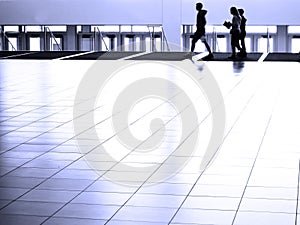 People walking on White Reflective Floor