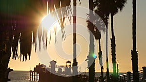 People walking on wooden pier, California USA. Oceanside waterfront tourist vacations resort.