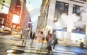 People walking on zebra crossing on West 31th st in Manhattan - New York City