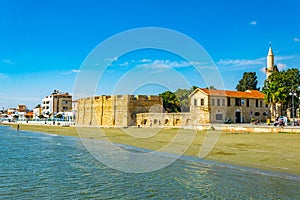 People are wandering around the medieval Castle of Larnaka, Cyprus