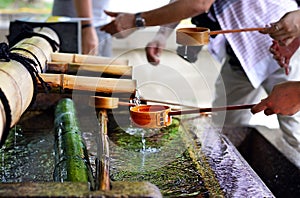 People washing hands, Yasaka Jinja, Kyoto, Japan