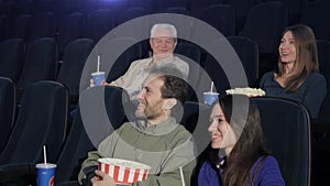 People watch comedy at the movie theater
