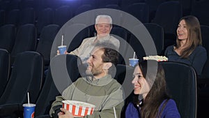 People watch comedy at the movie theater