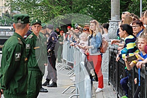 People watch the dress rehearsal of a military parade in honor of Victory Day in Volgograd