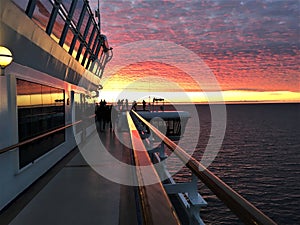 People watched and took photos of sunset at a cruise ship, Alaska