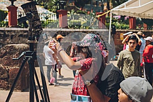 People watching the annular solar eclipse in Mexico with cameras and telescopes