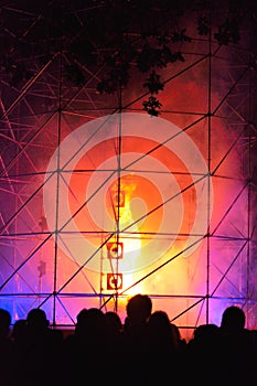 People watching a fire-tornado at a light-show