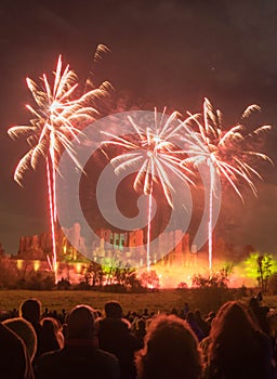 People watching Fireworks display at bonfire 4th of November celebration, Kenilworth Castle, united kingdom.