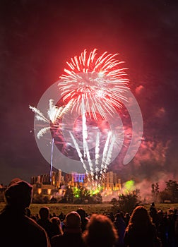 People watching Fireworks display at bonfire 4th of November celebration, Kenilworth Castle, united kingdom.