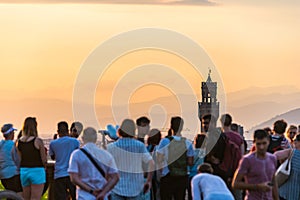 People watching Florence panorama. Palazzo Vecchio. Sunset from Piazzale Michelangelo. Tuscany, Italy