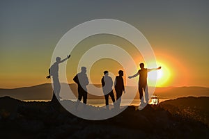 People watching the sunrise at the summit