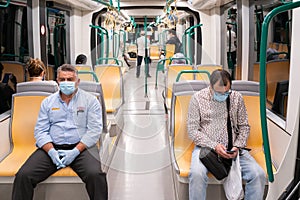 People wearing surgical mask in the train during the Covid-19 pandemic