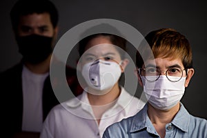 People wearing surgical masks looking worried concerned with pandemic outbreak situation