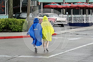 People Wearing Waterproof Ponchos on a Rainy Day
