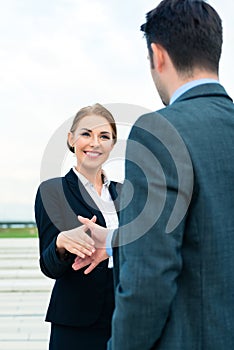 People welcoming with business handshake