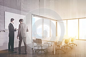 People in white panoramic meeting room corner