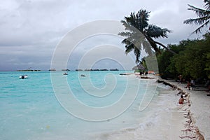 People at white sand beach Maldives