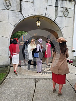 People who enjoy the monarchy day in the courtyard of the Elisabeta Palace