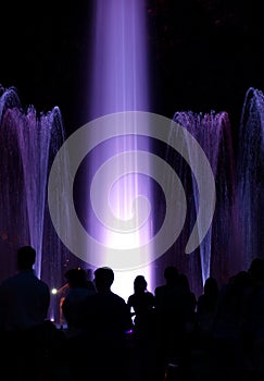 People wondering colourful fountain in Budapest