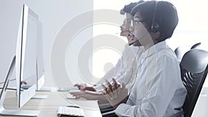 People Work At Contact Center. Woman In Headset Working