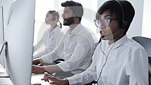 People Work At Contact Center. Woman In Headset Working