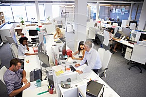 People working in a busy office photo