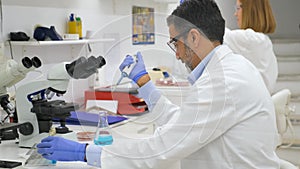 People working on a clinical microbiology laboratory.
