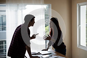 People working man and woman in a plaid shirt with disagreements