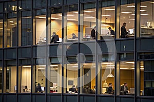 People working in office building at night