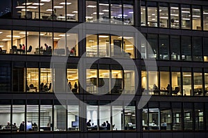 People working in office building at night