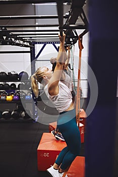 People working out with resistance bands during a gym class