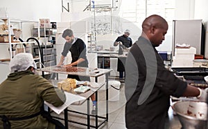 People working together in an artisanal chocolate making factory